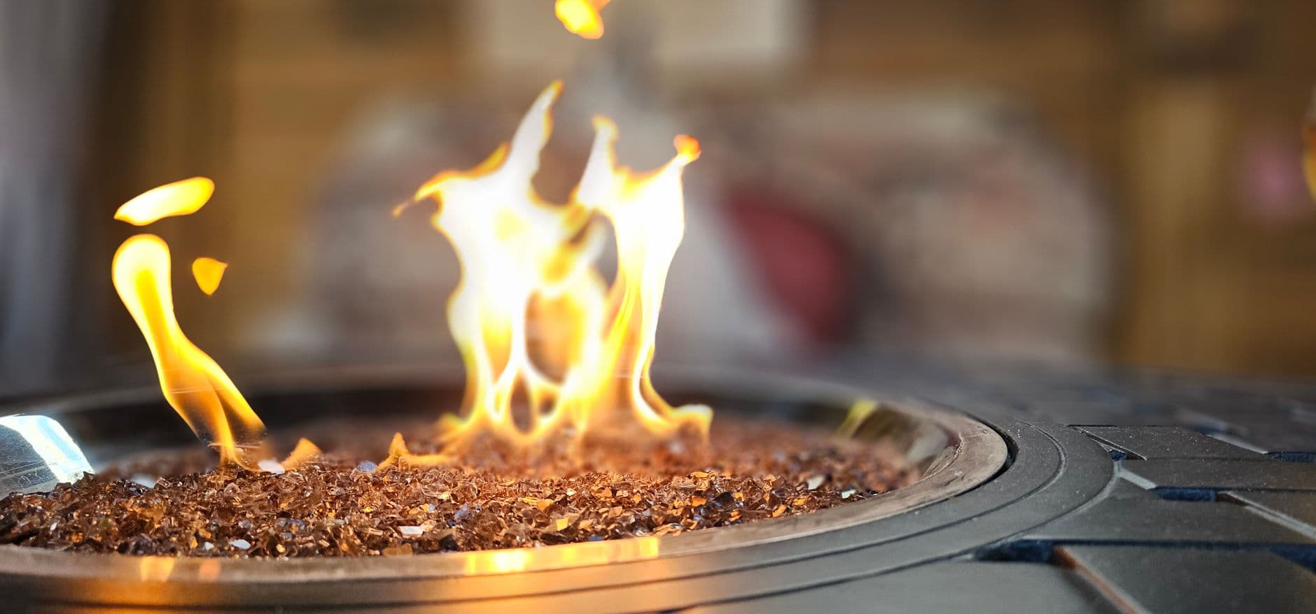A close-up view of a warm and inviting fire pit with flickering flames perfect for outdoor gatherings.